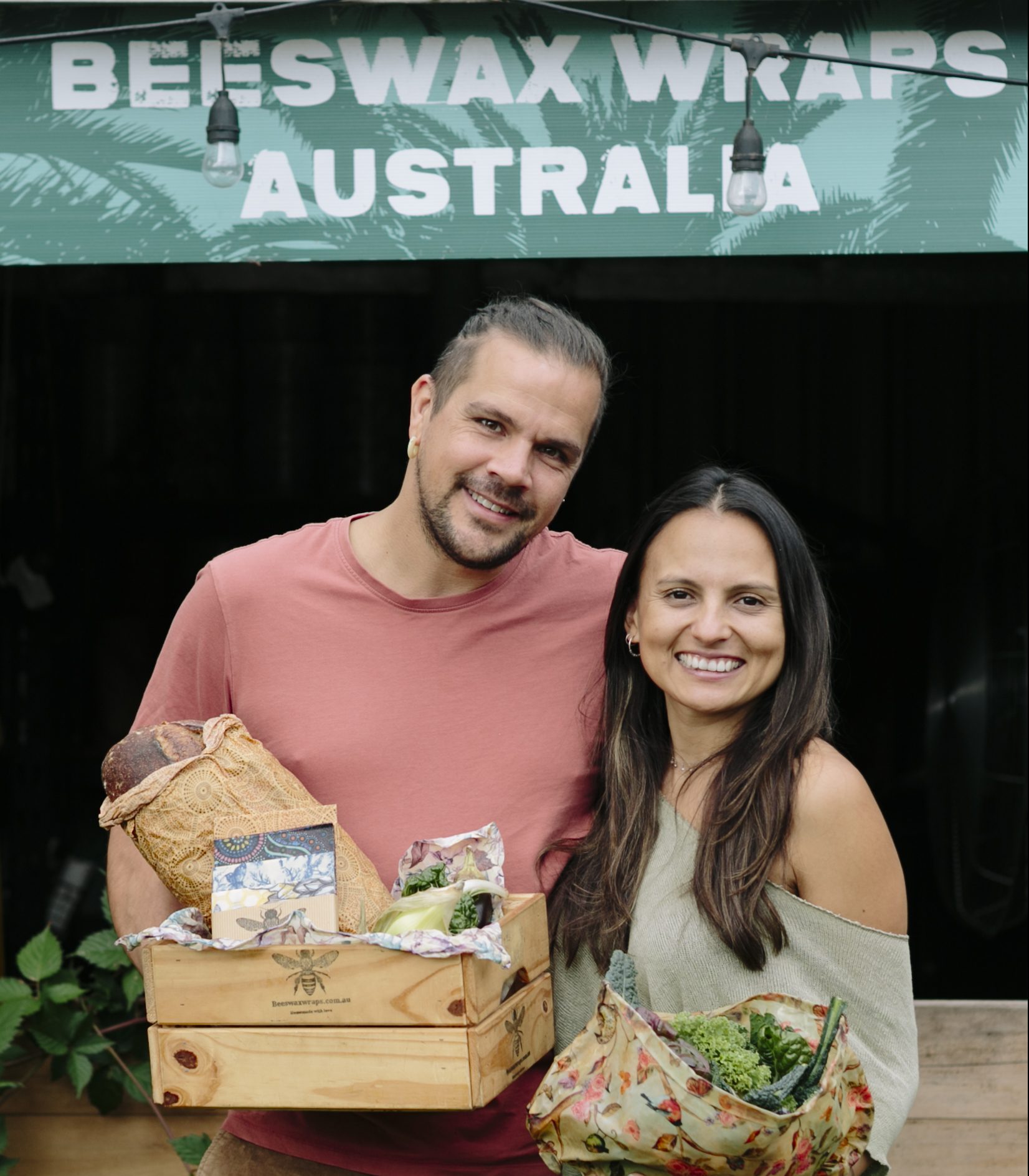 Josh and Angie, founders of Beeswax Wraps Australia, holding a box of handmade beeswax wraps
